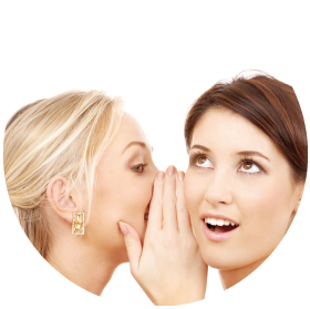 Girl whispering into another girls ear